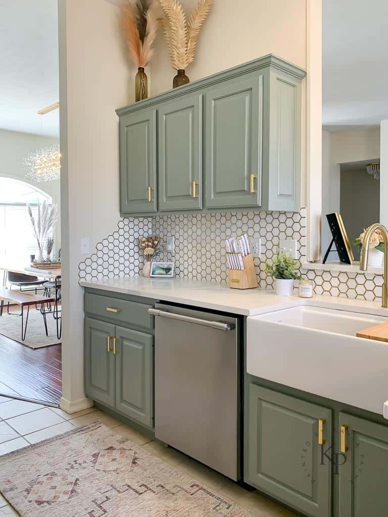 Light green painted kitchen cabinets.